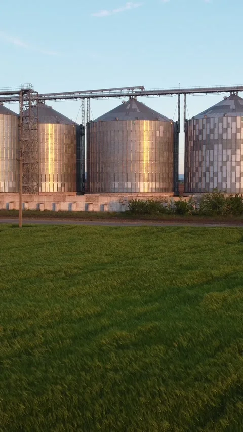 Grain elevator. Metal grain elevator in agricultural zone. Aerial vertical view Stock Footage 271032049