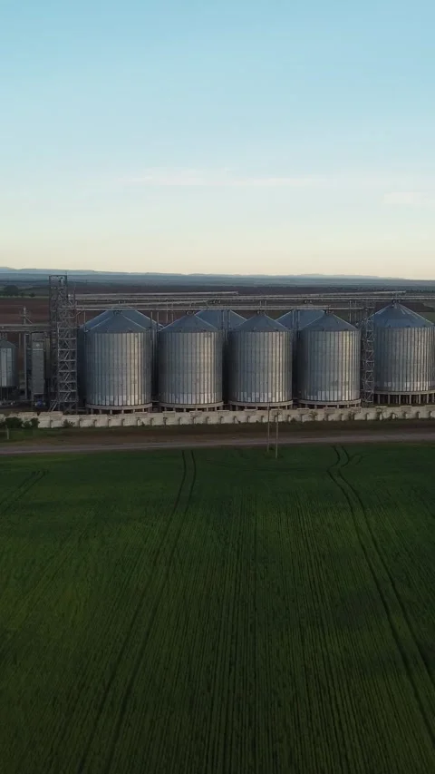 Grain elevator. Metal grain elevator in agricultural zone. Aerial vertical view Stock Footage 274389275