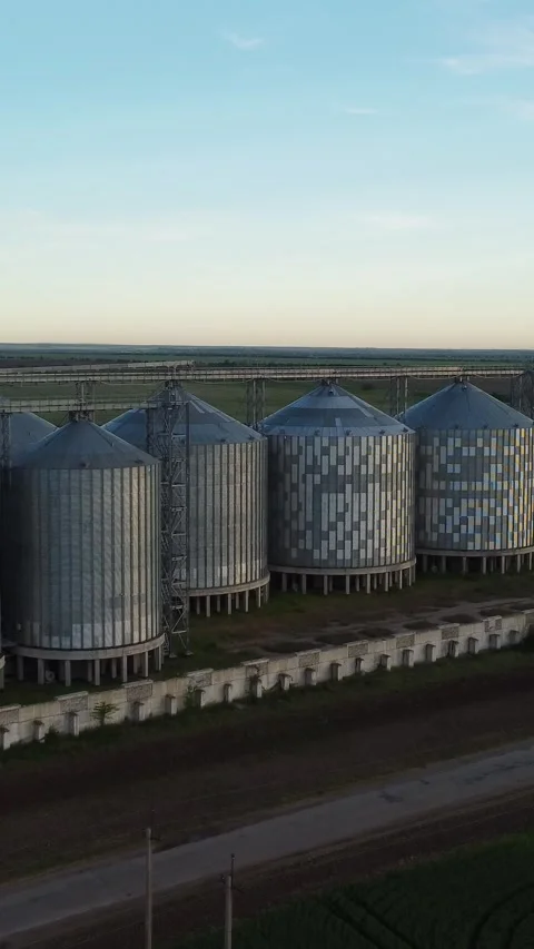 Grain elevator. Metal grain elevator in agricultural zone. Aerial vertical view Stock Footage 274434720