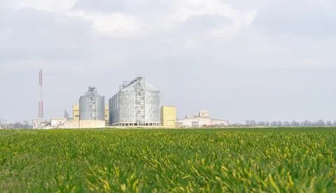 Grain elevator. Metal grain elevator in agricultural zone. Agriculture storage Stock Photos