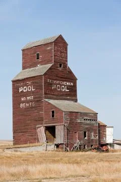 A grain elevator with a pool on the side Stock Photos