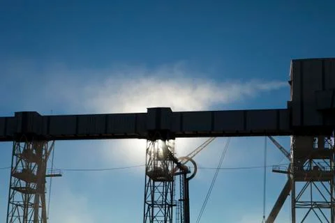 Grain elevator in sunlight Stock Photos