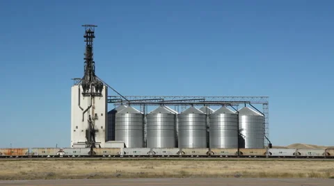 Grain elevator with train. Dunmore, Alberta, Canada. Traffic going by. Stock Footage 47468238