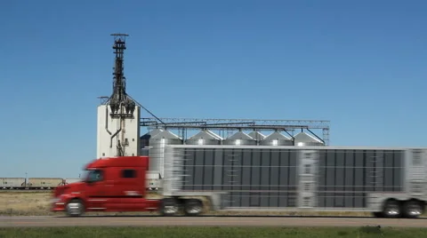 Grain elevator with train. Dunmore, Alberta, Canada. Red truck goes by. Stock Footage 47474595