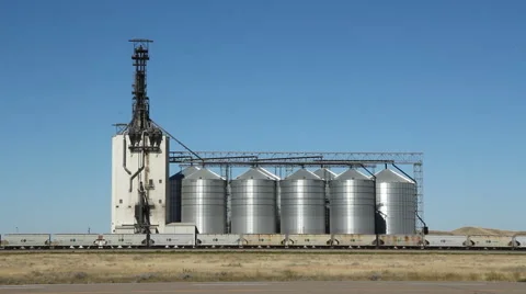 Grain elevator with train. Dunmore, Alberta, Canada. Traffic going by. Stock Footage 52182498