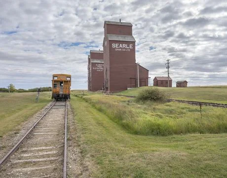 Grain Elevators and Train Caboose Stock Photos