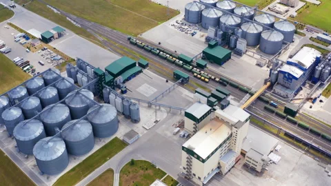 Grain elevators on field. Modern industry for agribusiness. Grain drying complex Stock Footage 158833773