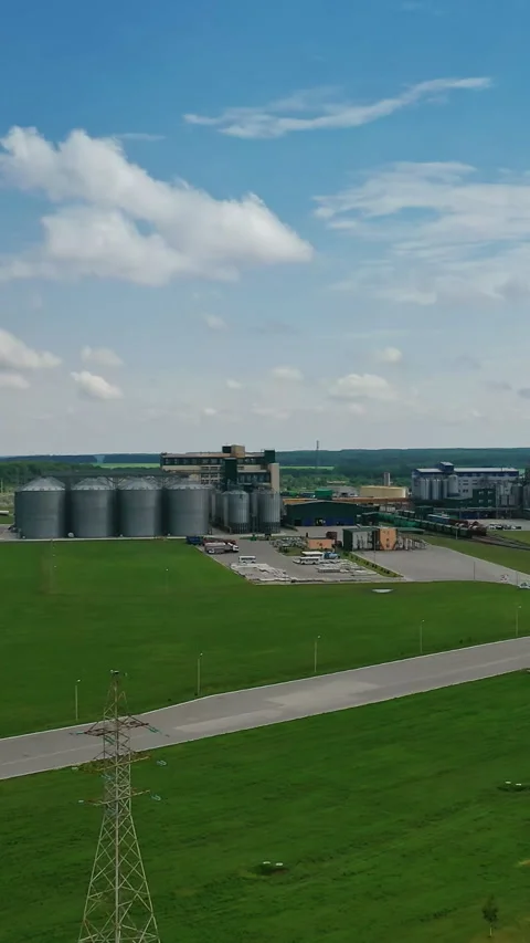 Grain elevators in meadow Stock Footage 298338829