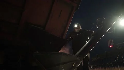 Grain loaded into combine before working Stock Footage 195094929