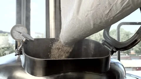 Grain pours into the tank in the process of beer production Stock Footage 64904015