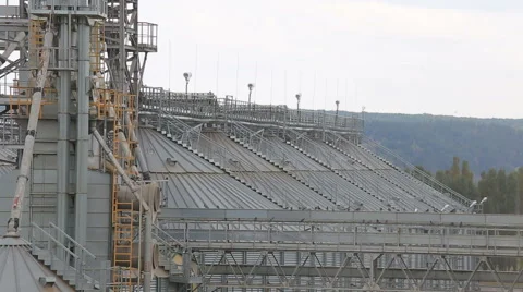 Grain processing plant Large storage space and metal pipes. Video stock 68827165
