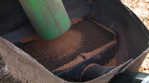 Grain is sifted through a grid Stock Footage 93664934