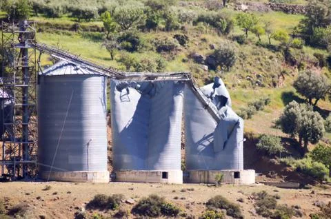Grain silos blowing Stock Photos