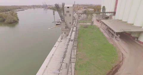 Grain silos, Industrial complex on Danube river from air. Stockbeeldmateriaal 71249402