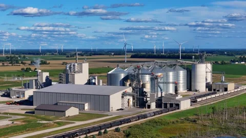 Grain silos, wind turbines, and railway in Ithaca, Michigan, showing Stock Footage 327610395