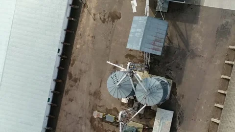Grain storage elevator, Large metal hangar for grain. Aerial view. Stock-Footage 234212357