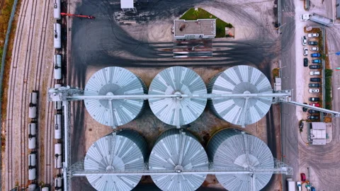 Grain storage facility with silos and trucks at a logistics center. Silos line Stock Footage 342734746