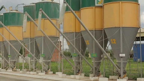 Grain is sucked up into the elevators through flexible tubes Stock Footage 73929398