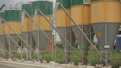 Grain is sucked up into the elevators through flexible tubes Stock Footage 73938556