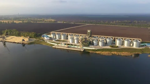 Grain Terminal. Steel Tanks of Elevator Near the River Stock Footage 129708849