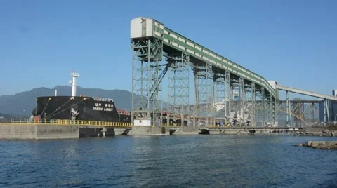 Grain Terminal WS of ship being loaded with grain.  Vancouver, BC Canada Stock Footage 53049377