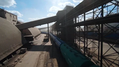 Grain train arrival at sea port for loading onto bulk carriers and export Stock Footage 304561879