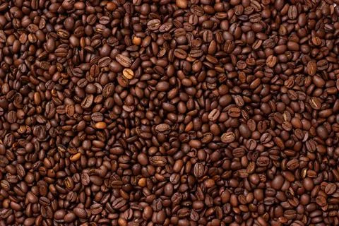 Grains coffee. Background from coffee beans. Roasted coffee beans. Brown coffee Stock Photos