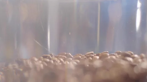 Grains pouring into a coffee machine Stock Footage 117579264