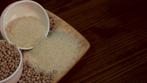 Grains of rice and beans, composition with rotation Stock Footage 133898595