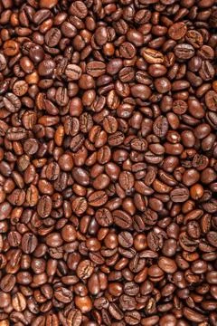 Grains of roasted coffee as a background Stock Photos