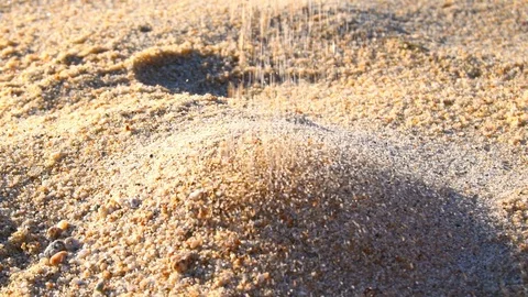 Grains of sand falling on the beach Stock Footage 113334545