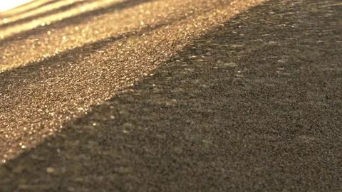 Grains of sand waving in the wind during sandstorm. Slow motion shot of golden 動画素材 301624708