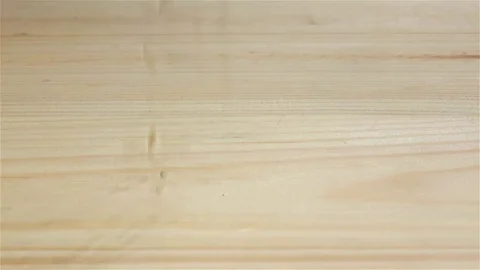 Grains wheat falling on wooden table, slow motion. Top view Stock-Footage 75490124