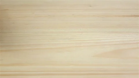 Grains wheat in slow motion falling on wooden table. Closeup Stock Footage 75489933