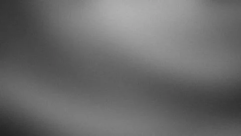 Grainy black gray white gradient background 4K abstract blurred texture wal.. Stock Photos