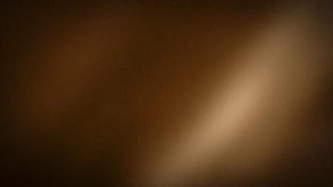 Grainy brown background with soft beige and dark brown tones 4K abstract gr.. Stock Photos