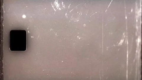 Grainy Film Texture featuring Light Leaks and Shadows for transitions and intros Stock Footage 317228587