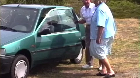 Grainy Footage Of Elderly Man Getting Inside Parked Car Stock Footage 322134211