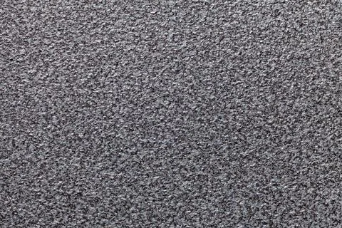 Grainy gray background with spotted pattern. Texture backdrop Illustrazione stock