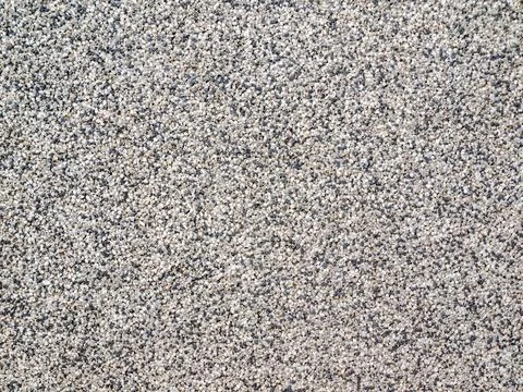 Grainy surface with tiny white black and gray rhinestones Stock Photos