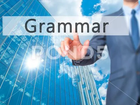 Grammar - Businessman hand pressing button on touch screen inter Stock Photos
