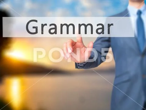 Grammar - Businessman hand pressing button on touch screen inter Stock Photos