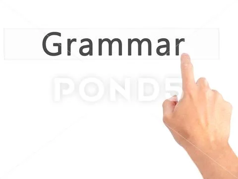 Grammar - Hand pressing a button on blurred background concept o Stock Photos