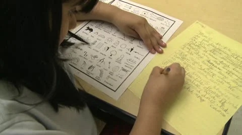 Grammar school student doing homework in classroom (1 of 6) Video stock 8979071