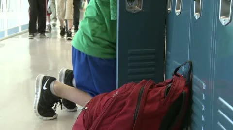 A grammar school student getting things out of locker (1 of 3) Stock Footage 8978943