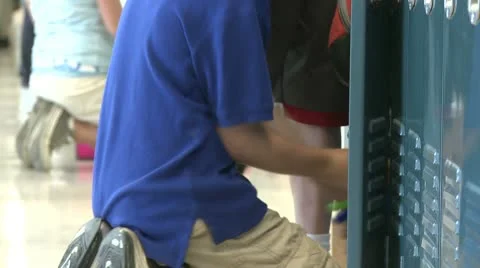 A grammar school student getting things out of locker (2 of 3) Stock Footage 8978947