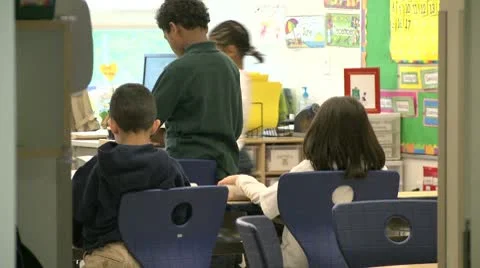 Grammar school  student standing in classroom Stock Footage 8979306