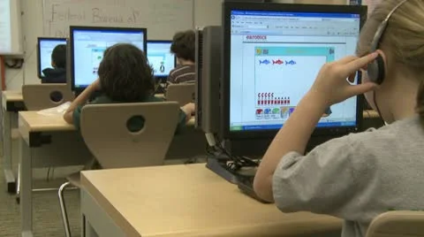Grammar school student using head set with computer Video stock 8979039