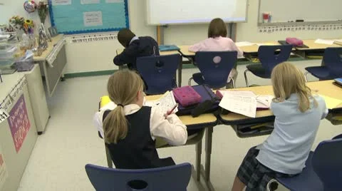 Grammar school students doing work in classroom (3 of 9) Stock Footage 8979096
