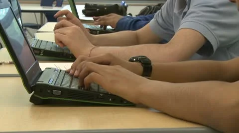 Grammar school students using computer in classroom (2 of 11) Stock Footage 8979002